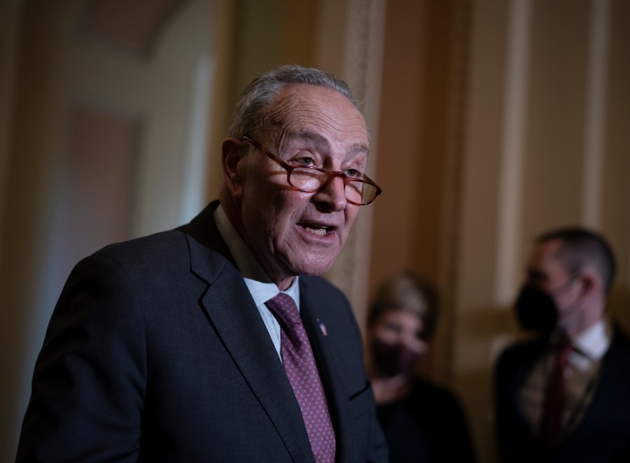 Senate Majority Leader Chuck Schumer, D-N.Y., speaks to reporters after a Democratic policy meeting at the Capitol in Washington, Tuesday, Dec. 14, 2021. (AP Photo/J. Scott Applewhite)