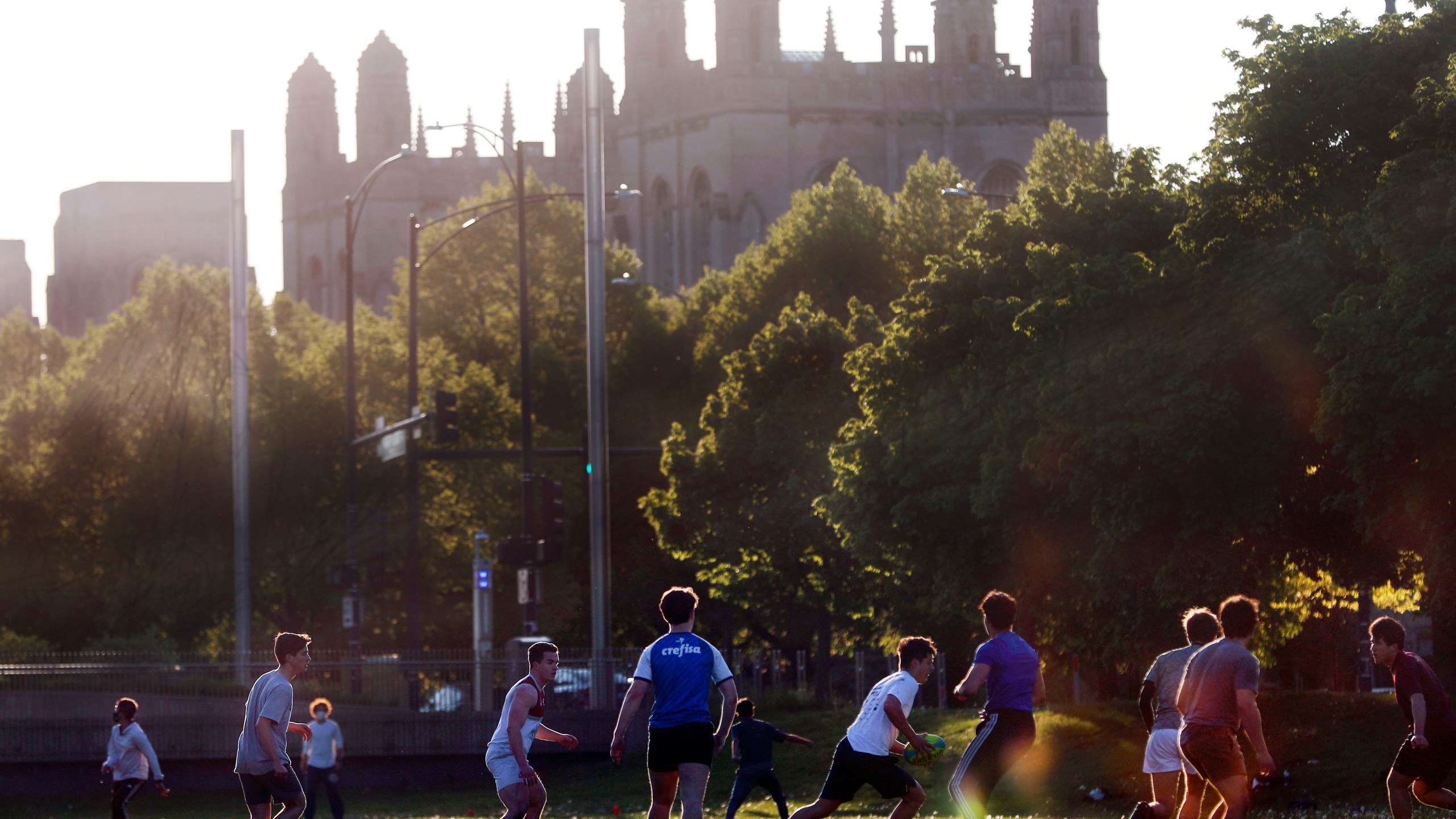 University of Chicago men's rugby team players practice on the Midway Plaisance near the campus in Chicago, May 6, 2021. (AP Photo/Shafkat Anowar, File)