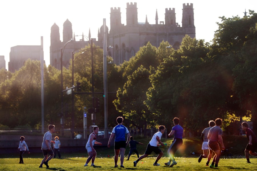 University of Chicago men's rugby team players practice on the Midway Plaisance near the campus in Chicago, May 6, 2021. (AP Photo/Shafkat Anowar, File)