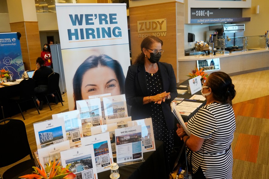 Marriott human resources recruiter Mariela Cuevas, left, talks to Lisbet Oliveros, during a job fair at Hard Rock Stadium on Sept. 3, 2021, in Miami Gardens, Fla. (AP Photo/Marta Lavandier, File)