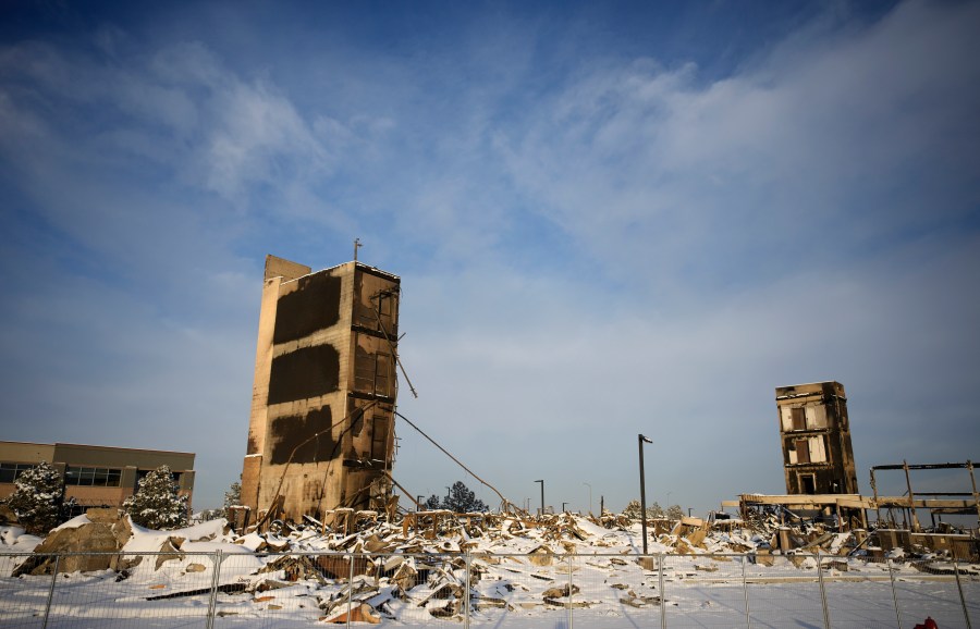 The charred remains of an Element Hotel destroyed by wildfires is seen on Jan. 6, 2022, in Superior, Colo. (David Zalubowski/Associated Press)