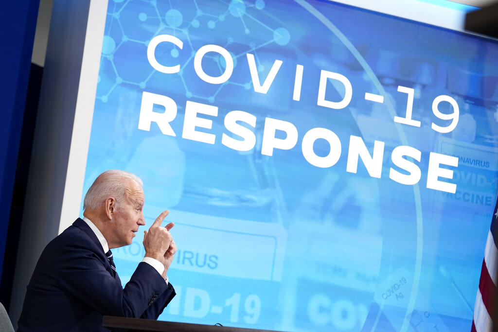 President Joe Biden speaks about the government's COVID-19 response, in the South Court Auditorium in the Eisenhower Executive Office Building on the White House Campus in Washington, Thursday, Jan. 13, 2022. (AP Photo/Andrew Harnik)