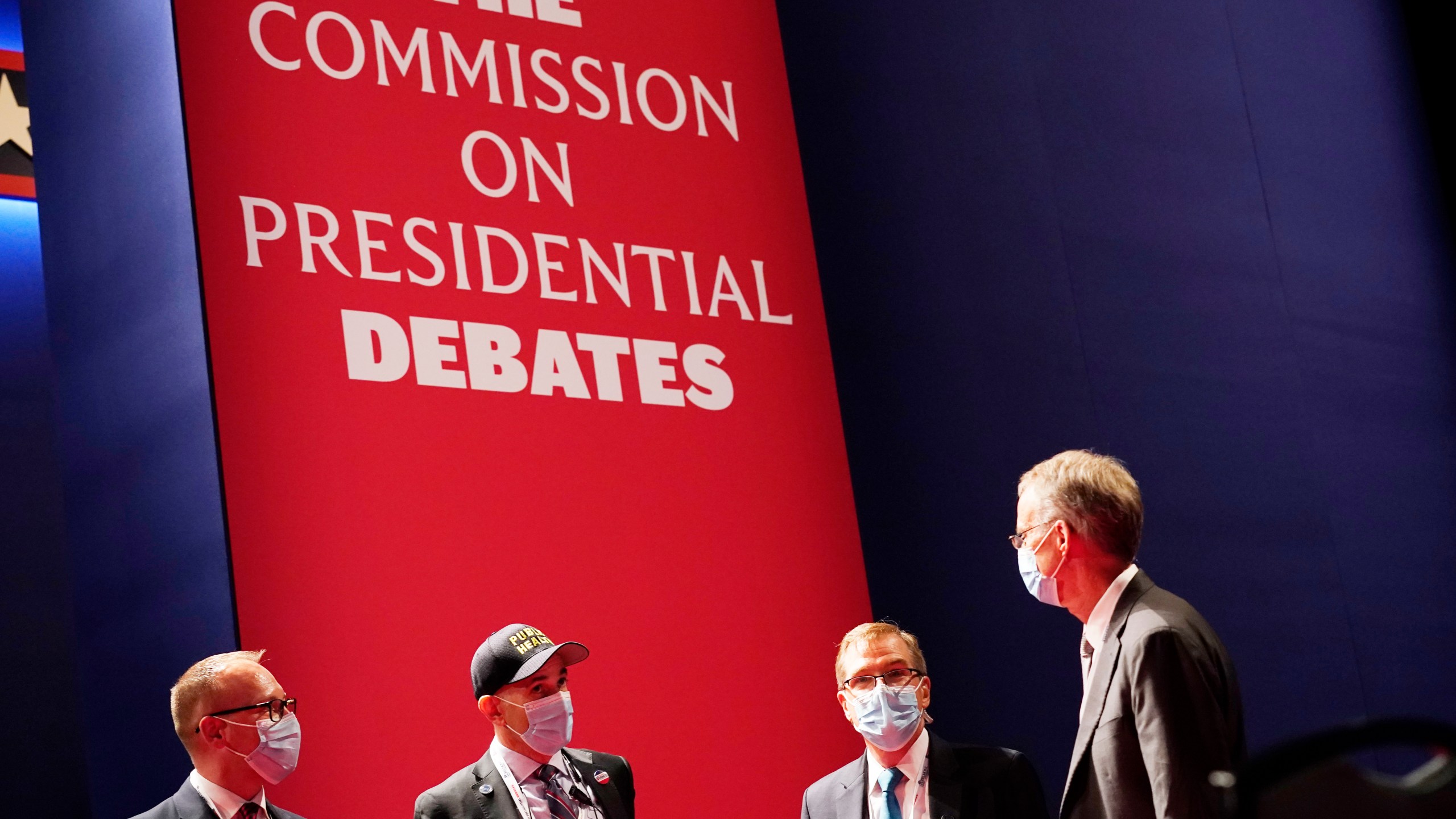 Officials from the Commission on Presidential Debates gather near the stage before the start of the second and final presidential debate, Oct. 22, 2020, at Belmont University in Nashville, Tenn. The Republican National Committee says it is planning a rules change that would force presidential candidates seeking the party’s nomination to sign a pledge saying they will not participate in any debates sponsored by the Commission on Presidential Debates. (AP Photo/Patrick Semansky, File)