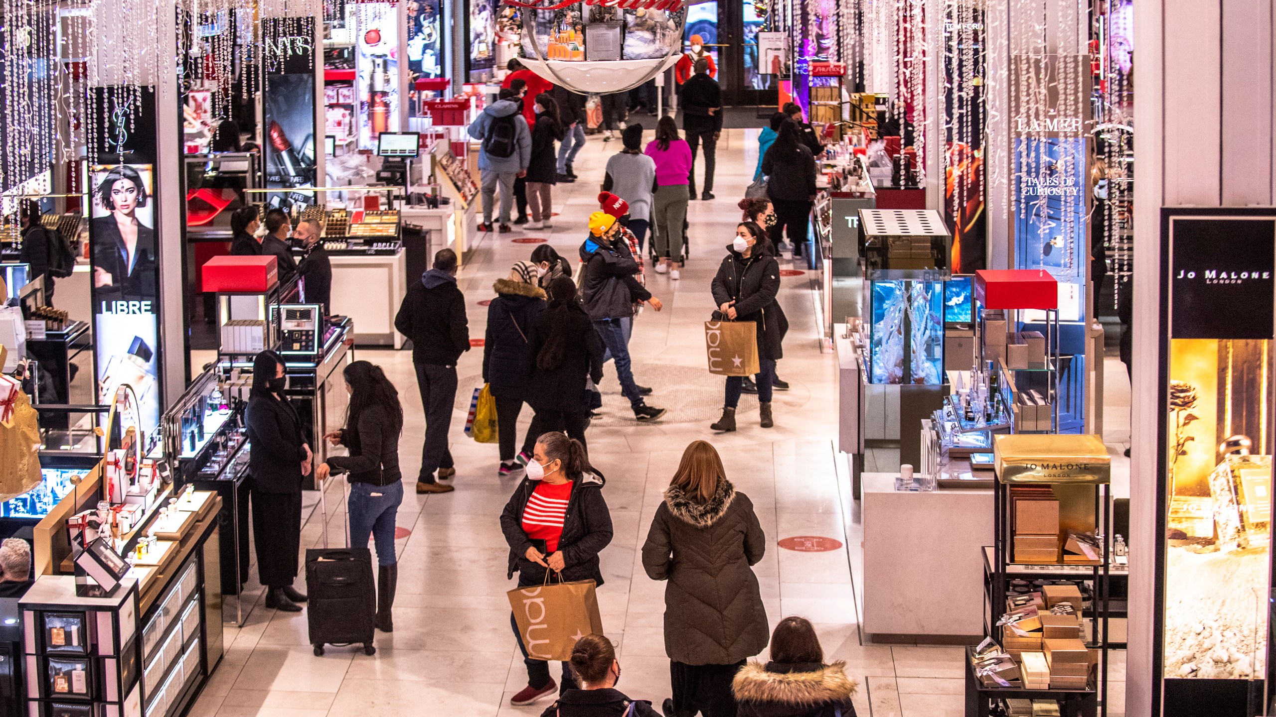 Shoppers walk through Macy's on Nov. 26, 2021, in New York. (AP Photo/Brittainy Newman, File)