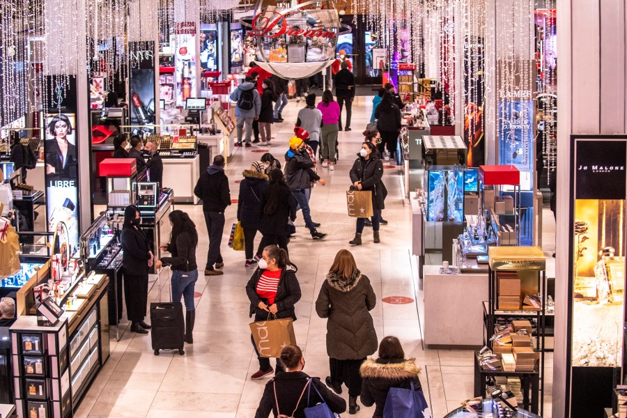 Shoppers walk through Macy's on Nov. 26, 2021, in New York. (AP Photo/Brittainy Newman, File)