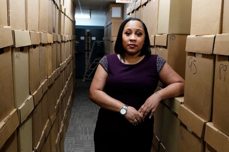 Fulton County District Attorney Fani Willis poses for a photo at her office, Feb. 24, 2021 in Atlanta. The Georgia prosecutor who’s investigating possible attempts to interfere in the 2020 general election by former President Donald Trump and others has asked for a special grand jury to aid the investigation. Willis, on Thursday, Jan. 20, 2022, sent a letter to Fulton County Superior Court Chief Judge Christopher Brasher asking him to impanel a special grand jury. (AP Photo/John Bazemore, File)