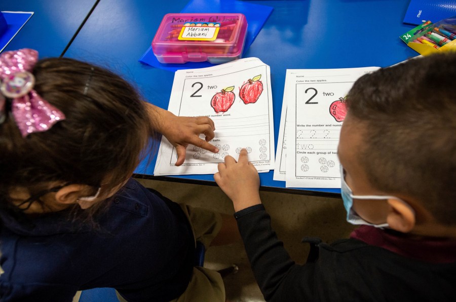 Kindergartners work together on their class assignment at Repetto Elementary School in Monterey Park, Calif., on Tuesday, Aug. 17, 2021. California’s Department of Education says that only 25% of students took statewide assessment tests in 2020-21 as schools scrambled to administer the exams in the midst of the pandemic. (Sarah Reingewirtz/The Orange County Register via AP, File)