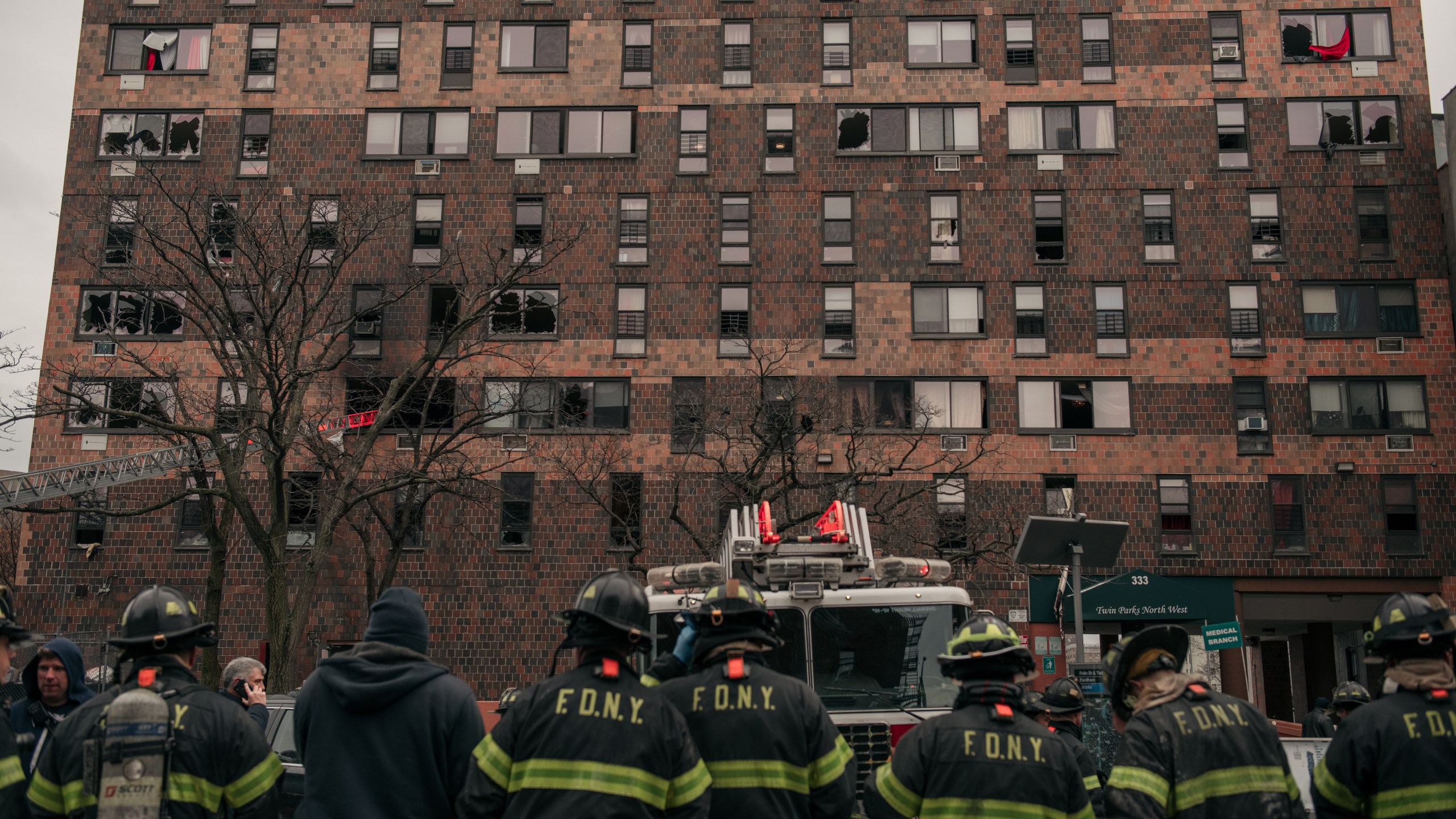 Emergency first responders remain at the scene after an intense fire at a 19-story residential building that erupted in the morning on January 9, 2022 in the Bronx borough of New York City. (Photo by Scott Heins/Getty Images)