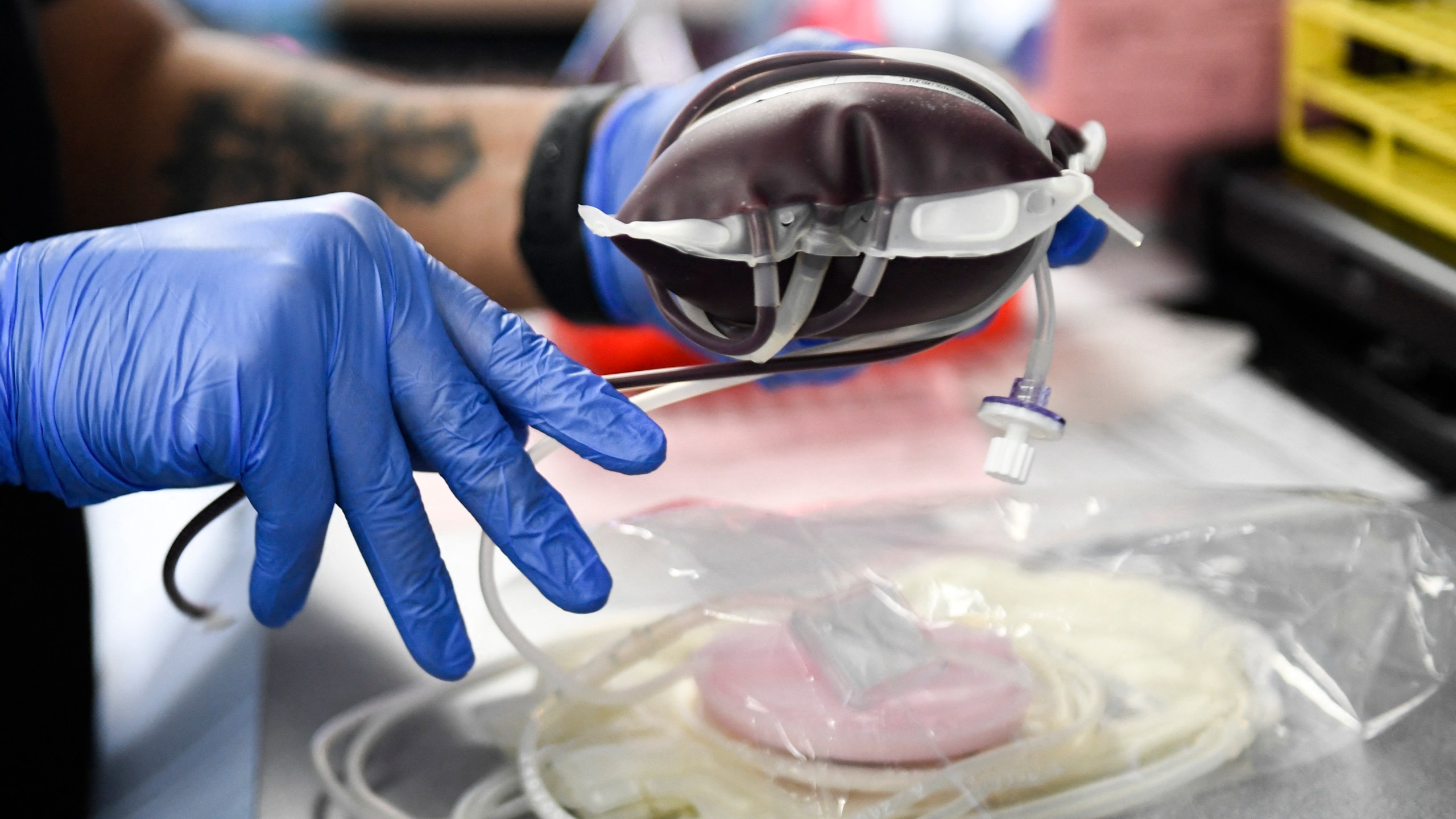 A pint of donated blood is packaged for transportation during a Children's Hospital Los Angeles blood donation drive in the LA Kings blood mobile outside the Crypto.com Arena on Jan.13, 2022 in Los Angeles. (PATRICK T. FALLON/AFP via Getty Images)