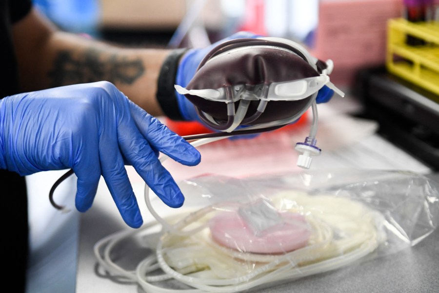 A pint of donated blood is packaged for transportation during a Children's Hospital Los Angeles blood donation drive in the LA Kings blood mobile outside the Crypto.com Arena on Jan.13, 2022 in Los Angeles. (PATRICK T. FALLON/AFP via Getty Images)