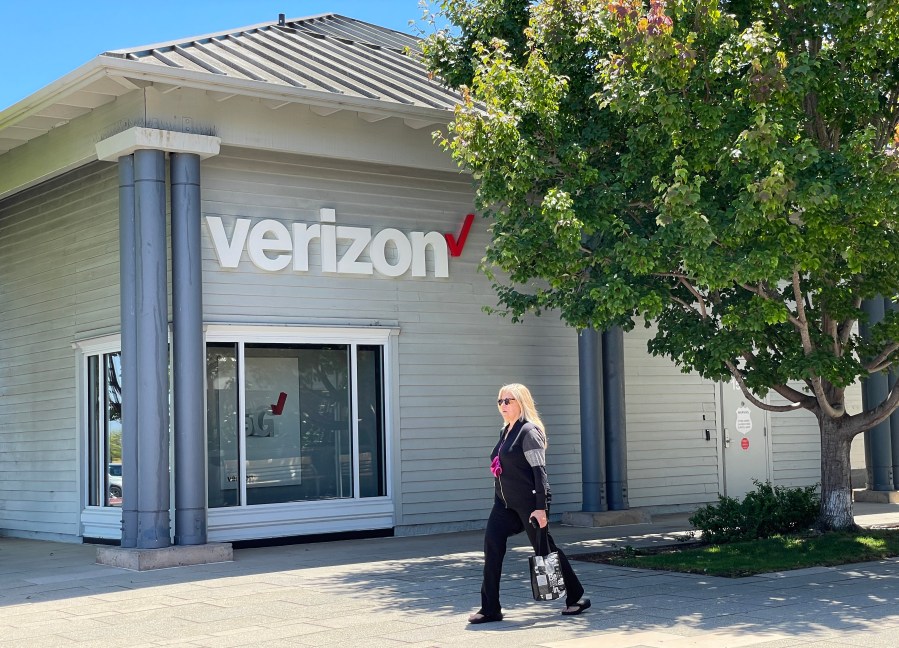 A pedestrian walks by a Verizon store on July 21, 2021 in Corte Madera, California. ( Justin Sullivan/Getty Images)