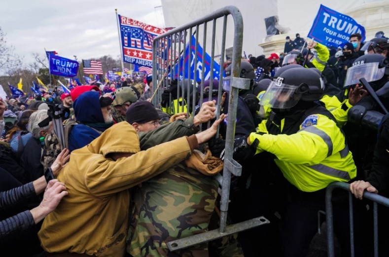 Pro-Trump rioters try to force their way through a police barricade outside the U.S. Capitol on Jan. 6, 2021.(Kent Nishimura/Los Angeles Times)