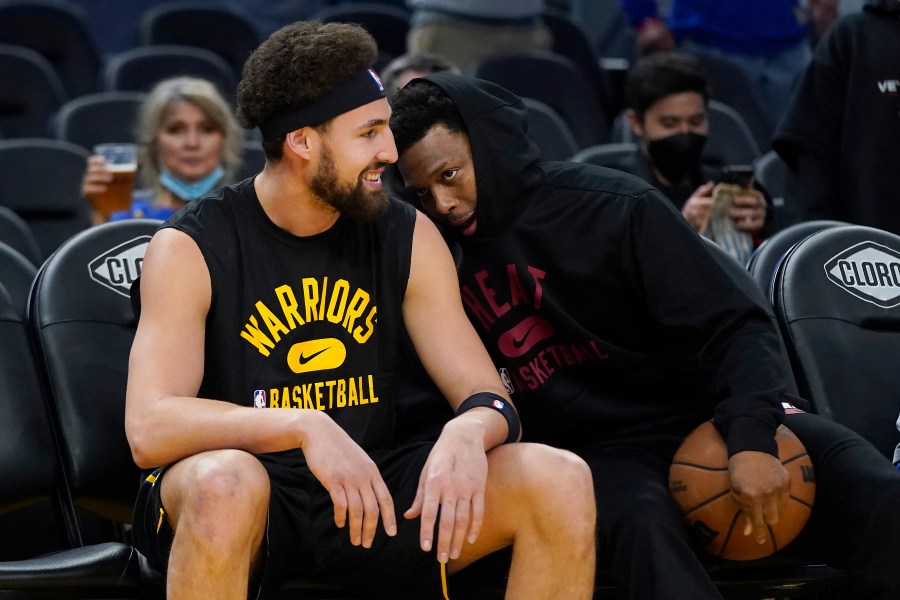 Golden State Warriors guard Klay Thompson, left, talks with Miami Heat guard Kyle Lowry before an NBA basketball game in San Francisco, Monday, Jan. 3, 2022. (AP Photo/Jeff Chiu)