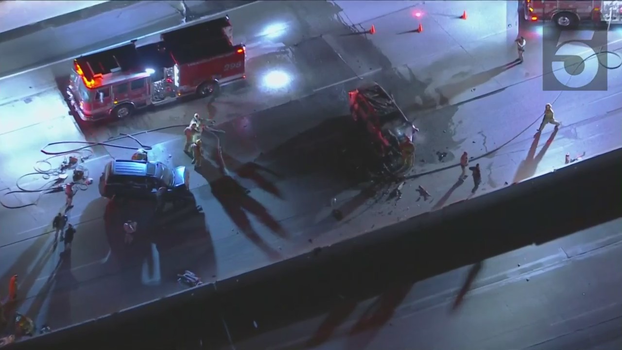 Four people were hurt and a car caught fire in a two-car crash on the 210 Freeway on Jan. 30, 2022. (KTLA)