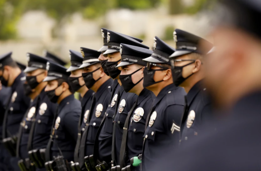 LAPD officers attend the funeral of LAPD Officer Valentin Martinez, the agency’s first sworn employee to die of complications from COVID-19, in August 2020. (Al Seib / Los Angeles Times)