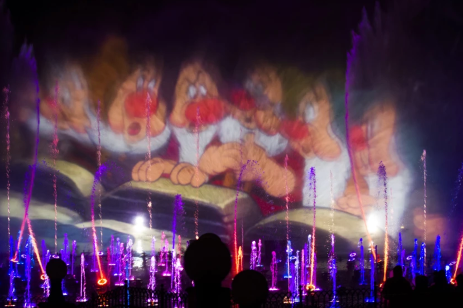 An image from “Snow White and the Seven Dwarfs” is projected on spraying water in 2015 at Disney California Adventure’s “World of Color: Celebrate!” (Allen J. Schaben / Los Angeles Times)