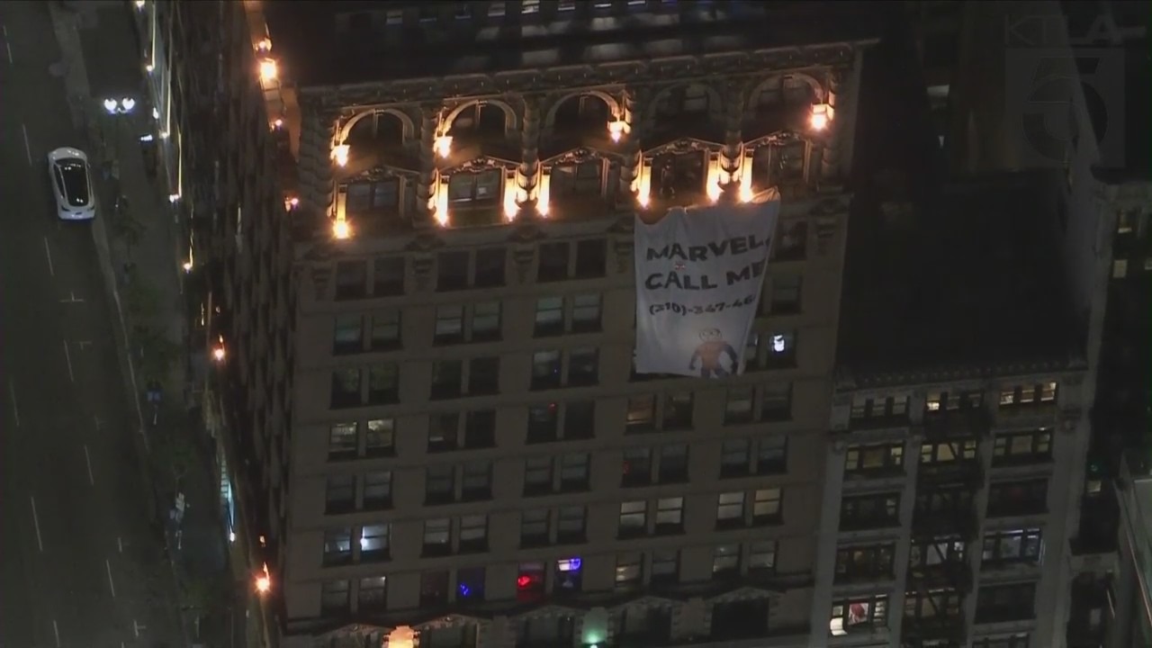 Someone dressed as Spider-Man climbed a building in downtown Los Angeles on Jan. 20, 2022. (KTLA)