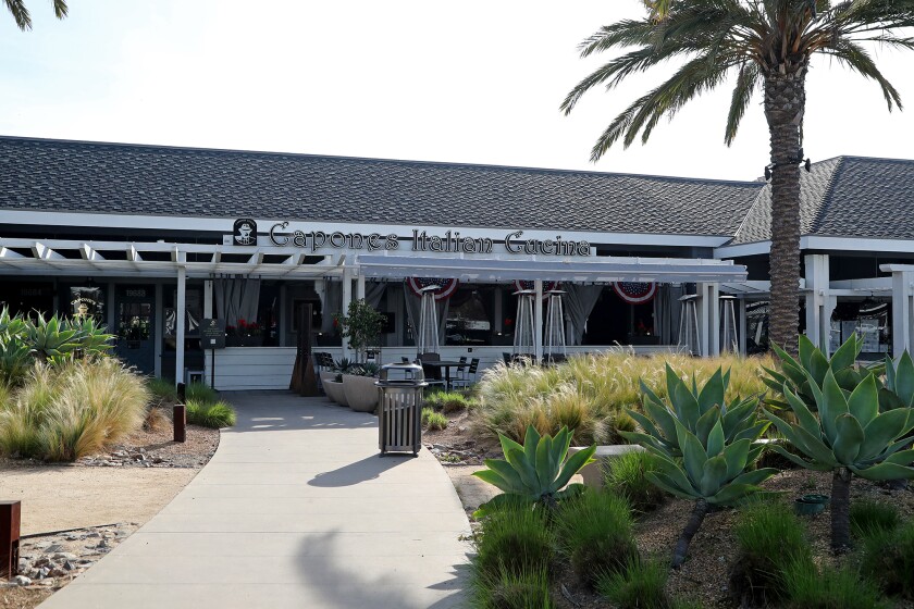 Capone’s Italian Cucina restaurant in Huntington Beach, seen in an undated photo, is involved in a lawsuit against Farmers Insurance, along with restaurants in Santa Clarita, Newport Beach and San Diego. They are alleging that Farmers breached contracts and didn’t compensate them for losses during the COVID-19 pandemic.(Kevin Chang / L.A. Times Community News)