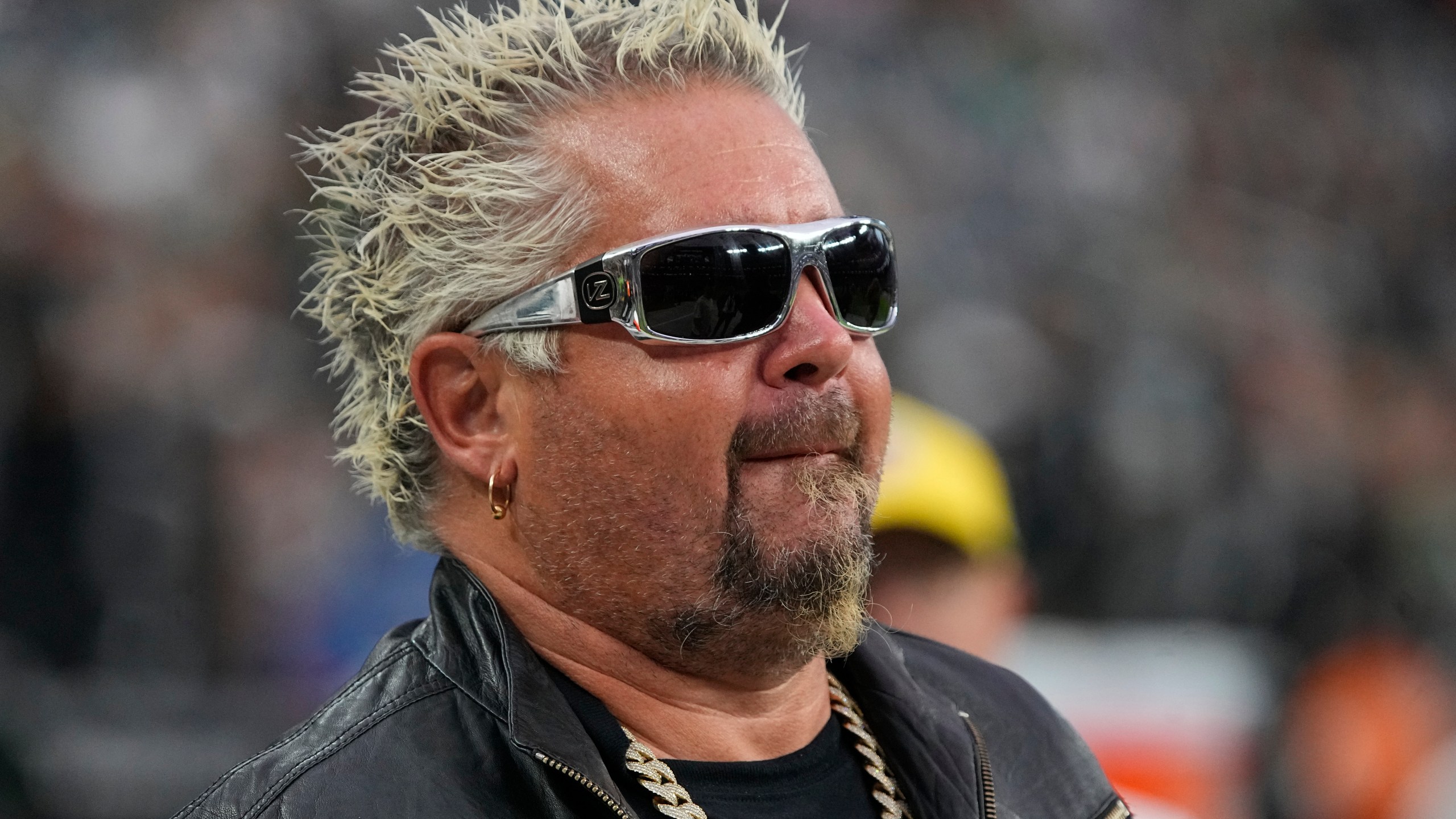 Guy Fieri during the second half of an NFL football game between the Las Vegas Raiders and the Philadelphia Eagles, Sunday, Oct. 24, 2021, in Las Vegas. (AP Photo/Rick Scuteri)