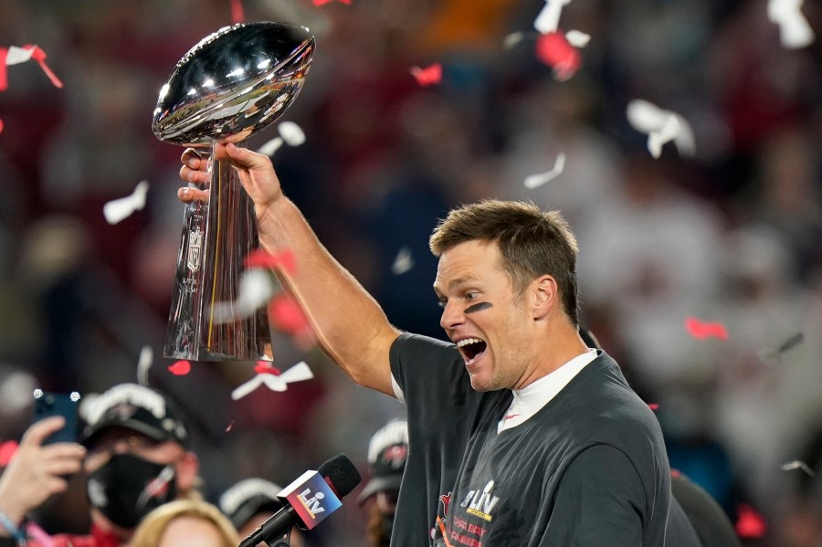 In this Feb. 7, 2021, file photo, Tampa Bay Buccaneers quarterback Tom Brady celebrates with the Vince Lombardi Trophy after the team's NFL Super Bowl 55 football game against the Kansas City Chiefs in Tampa, Fla. Tom Brady has retired after winning seven Super Bowls and setting numerous passing records in an unprecedented 22-year-career. He made the announcement, Tuesday, Feb. 1, 2022, in a long post on Instagram. (AP Photo/Lynne Sladky, File)