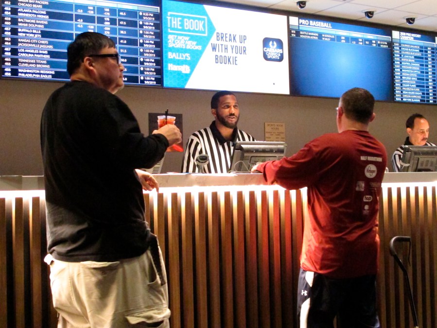 A gambler makes a sports bet at Bally's casino in Atlantic City N.J., Sept. 5, 2019. A record 31.5 million Americans plan to bet on this year's Super Bowl, according to the gambling industry's national trade group. The American Gaming Association on Tuesday, Feb. 8, 2022, released its annual predictions for wagering on pro football's championship game, forecasting that over $7.6 billion will be bet legally and otherwise. (AP Photo/Wayne Parry, File)