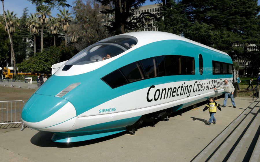 A full-scale mock-up of a high-speed train, is displayed at the Capitol in Sacramento, Calif., on Feb. 26, 2015. The California High-Speed Rail Authority's biennial business plan, released Tuesday, Feb. 8, 2022, shows the estimated cost of the project rising by about $5 billion, compared to the 2020 plan, up to as much as $105 billion. (AP Photo/Rich Pedroncelli, File)