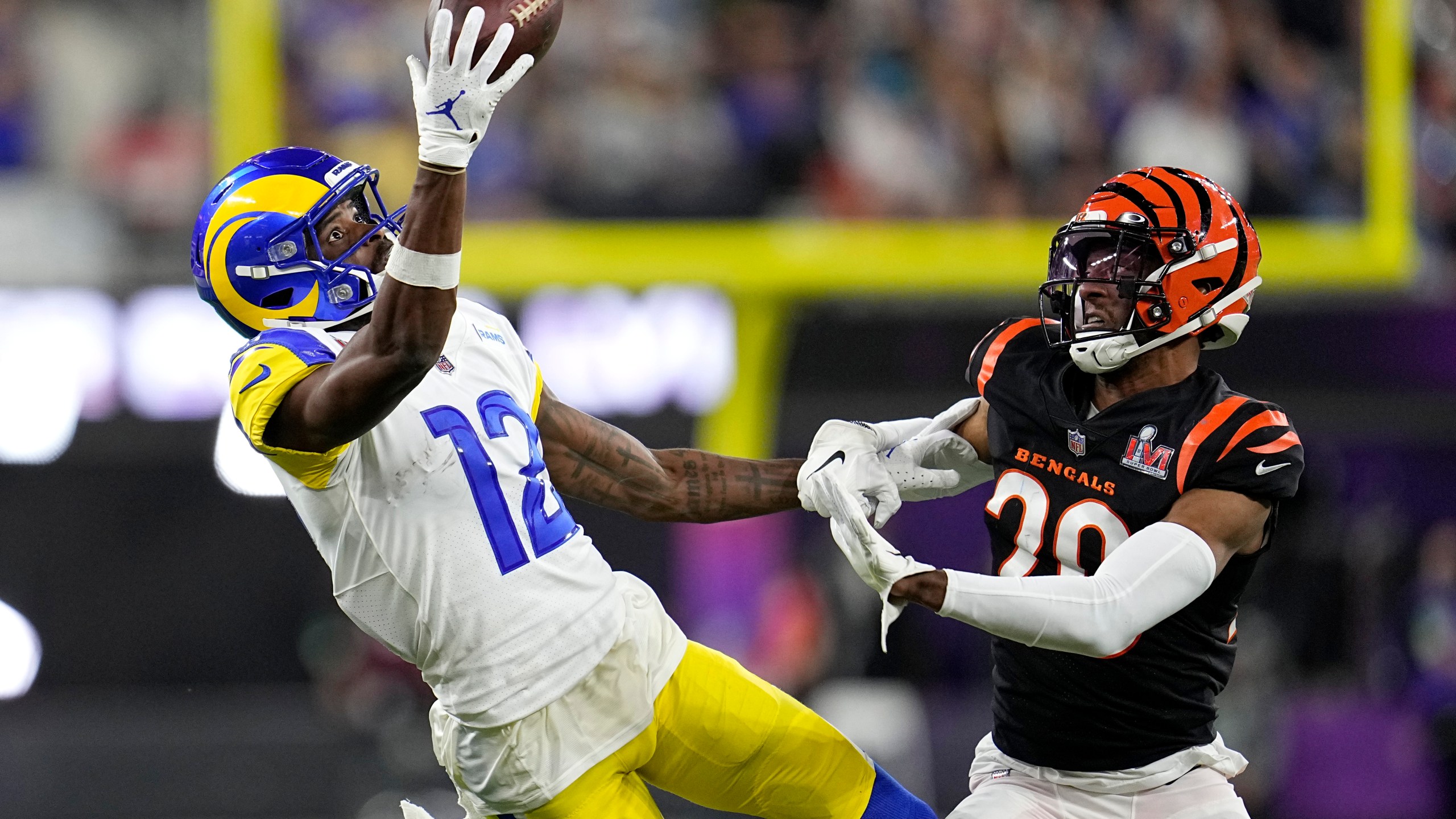 Los Angeles Rams wide receiver Van Jefferson (12) attempts a catch against Cincinnati Bengals cornerback Eli Apple during the second half of the NFL Super Bowl 56 on Feb. 13, 2022, in Inglewood. (Marcio Jose Sanchez/Associated Press)