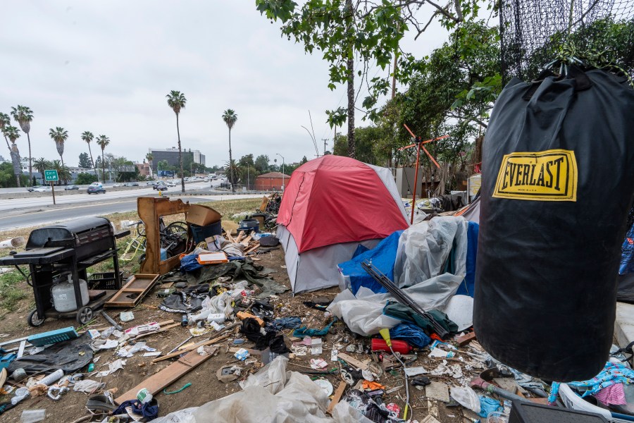 A trashed punching bag is left at a homeless encampment on the side of the CA-101 highway in Echo Park neighborhood in Los Angeles Tuesday, May 11, 2021. From homelessness to rising crime, Los Angeles residents are unhappy and frustrated. The campaign for the city's next mayor will test if voters in the liberal-minded city could embrace a new mayor with a tough approach to crime and sprawling homeless encampments that have spread into virtually every neighborhood. (AP Photo/Damian Dovarganes,File)