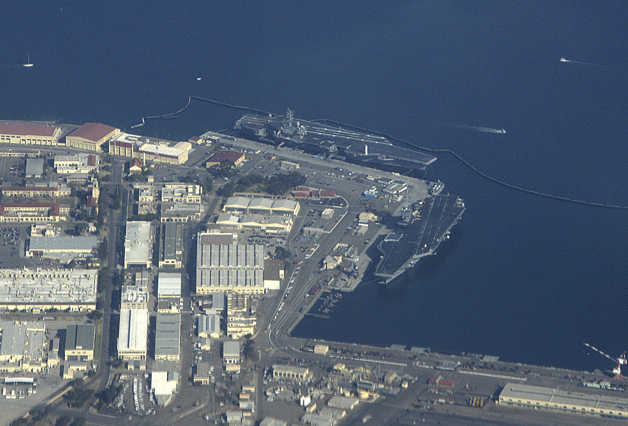 The U.S. Navy Aircraft carriers USS Ronald Reagan (CVN-76) left, and USS Nimitz (CVN-68) are seen docked at Naval Air Station North Island in San Diego Bay, on Jan. 21, 2007. The main entrance to North Island Naval Air Station near San Diego was shut down after a motorist was found with bomb-making materials. A military spokesman says the vehicle approached the gate around 9 a.m. and was stopped and searched at the request of Naval Criminal Investigative Service officials. (Scott M. Lieberman/Associated Press)