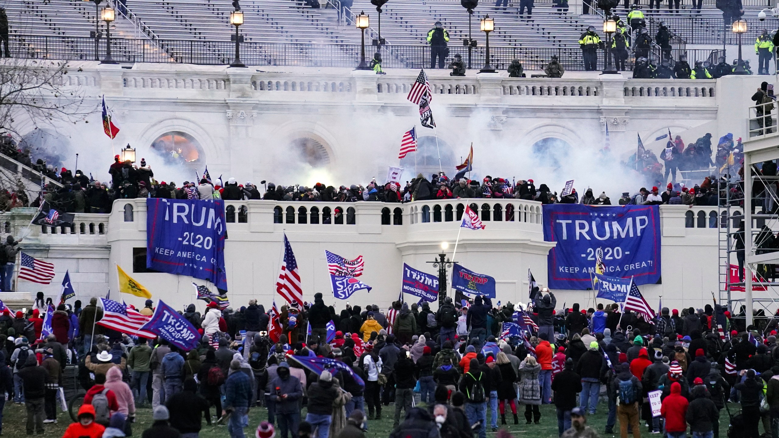 Violent insurrectionists, loyal to President Donald Trump, storm the Capitol in Washington on Jan. 6, 2021. The first trial for one of the hundreds of Capitol riot prosecutions starts this week, with jury selection scheduled to begin on Monday, Feb. 28, 2022, for the case against Guy Wesley Reffitt. (AP Photo/John Minchillo, File)