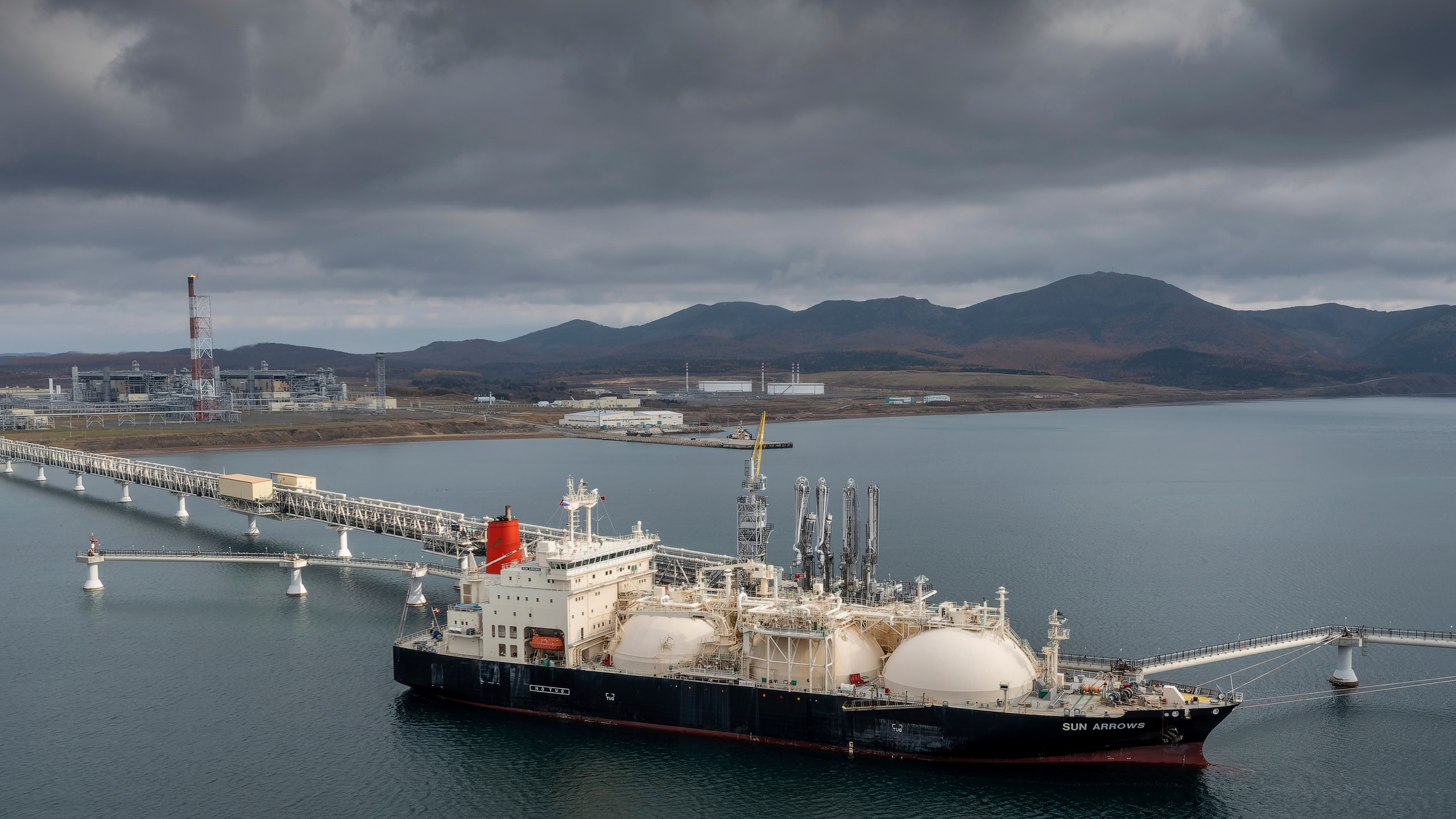 The tanker Sun Arrows loads its cargo of liquefied natural gas from the Sakhalin-2 project in the port of Prigorodnoye, Russia, Oct. 29, 2021. There is a glaring carve-out in President Joe Biden's sanctions against Russia: Oil and natural gas from that country will continue to flow freely to the rest of the world and money will keep flowing into Russia. (AP Photo, File)