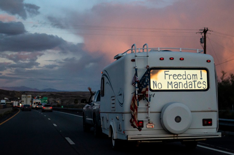 A trailer with the words "Freedom! No Mandate" on its back window is shown in Needles, Calif. as it heads toward Washington D.C. to protest COVID-19 on Feb. 23, 2022. (Nathan Howard/Associated Press)