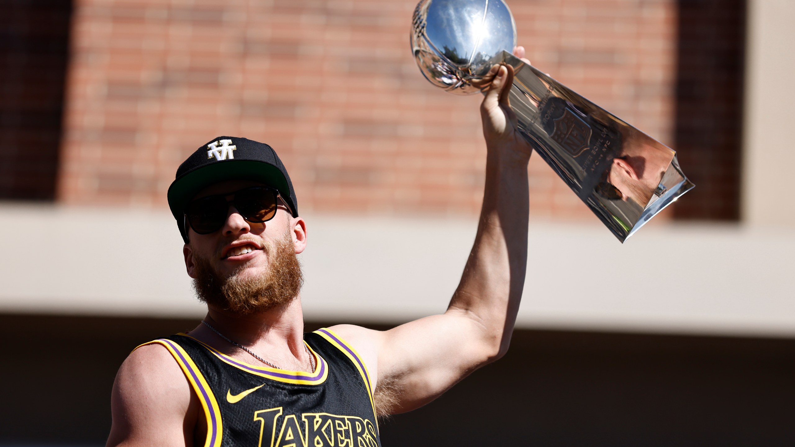 Super Bowl MVP Cooper Kupp #10 of the Los Angeles Rams celebrates with the Vince Lombardi Trophy during the Super Bowl LVI Victory Parade on Feb. 16, 2022 in Los Angeles, California. (Michael Owens/Getty Images)