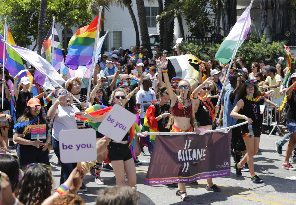 Participants with the Alliance for GLBTQ Youth march at the annual Miami Beach Gay Pride Parade, Sunday, April 9, 2017, in Miami Beach, Fla. Republican-backed legislation in Florida that could severely limit discussion of gay and lesbian issues in public schools is being widely condemned as dangerous and discriminatory, with one gay Democratic lawmaker saying it’s an attempt to silence LGBTQ students, families and history. (AP Photo/Lynne Sladky, File)