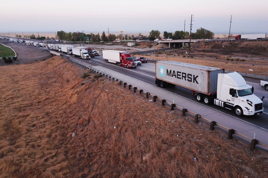 An aerial picture taken on August 26, 2021, shows trucks, cars, and other vehicles sitting in traffic due to road construction on Interstate 5 as they transit through the Tejon Pass from the Grapevine in Kern County, California. (PATRICK T. FALLON/AFP via Getty Images)