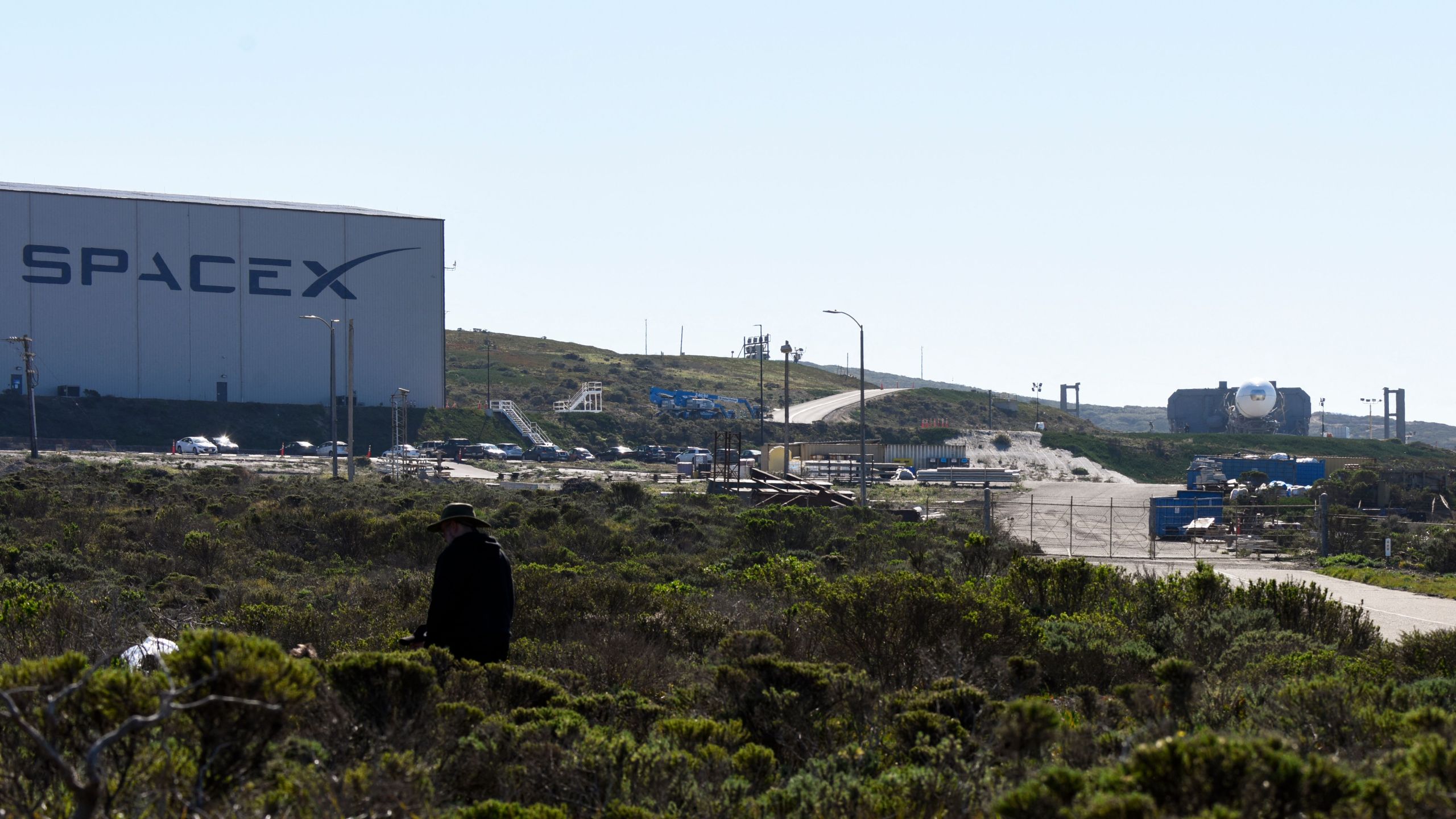 A Space Exploration Technologies Corp. (SpaceX) Falcon 9 rocket (R) with a payload for the National Reconnaissance Office is seen at the SLC-4E launch pad ahead of the NROL-87 launch from the Vandenberg U.S. Space Force Base in Lompoc on Feb. 1, 2022. (Patrick T. FALLON / AFP via Getty Images)