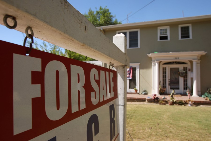 A "for sale" sign stands outside an existing home on Sept. 24, 2009 in Pasadena. (David McNew/Getty Images)