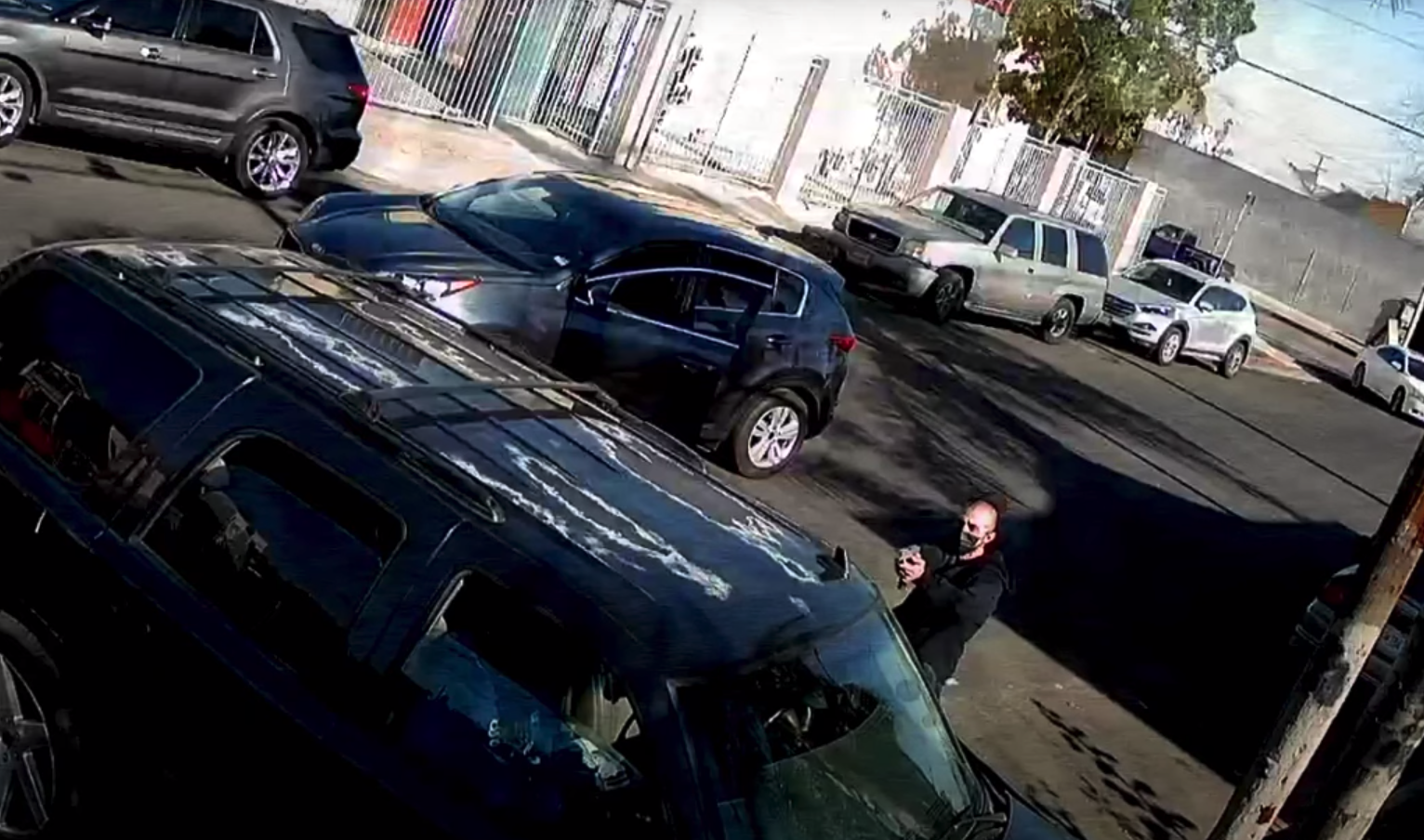 A still from surveillance video released by LAPD shows a man sought in the fatal shooting of a 16-year-old boy in South L.A. on Feb. 2, 2022.