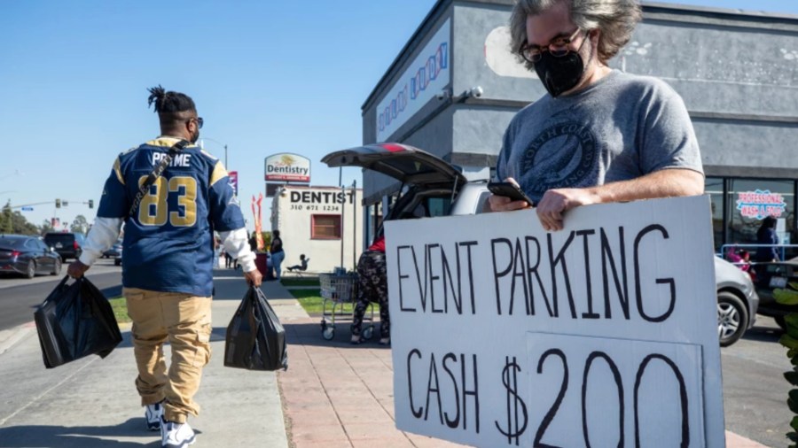 Steve Cohen, who owns a business on Manchester Boulevard, took advantage of his proximity to SoFi Stadium to sell parking spots for the NFC championship game.(Myung J. Chun / Los Angeles Times)