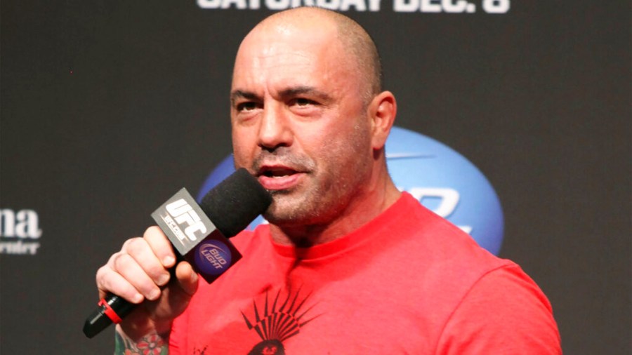 Joe Rogan speaks at the weigh in before a UFC on FOX 5 event in Seattle, on Dec. 7, 2012. (AP Photo/Gregory Payan, File)