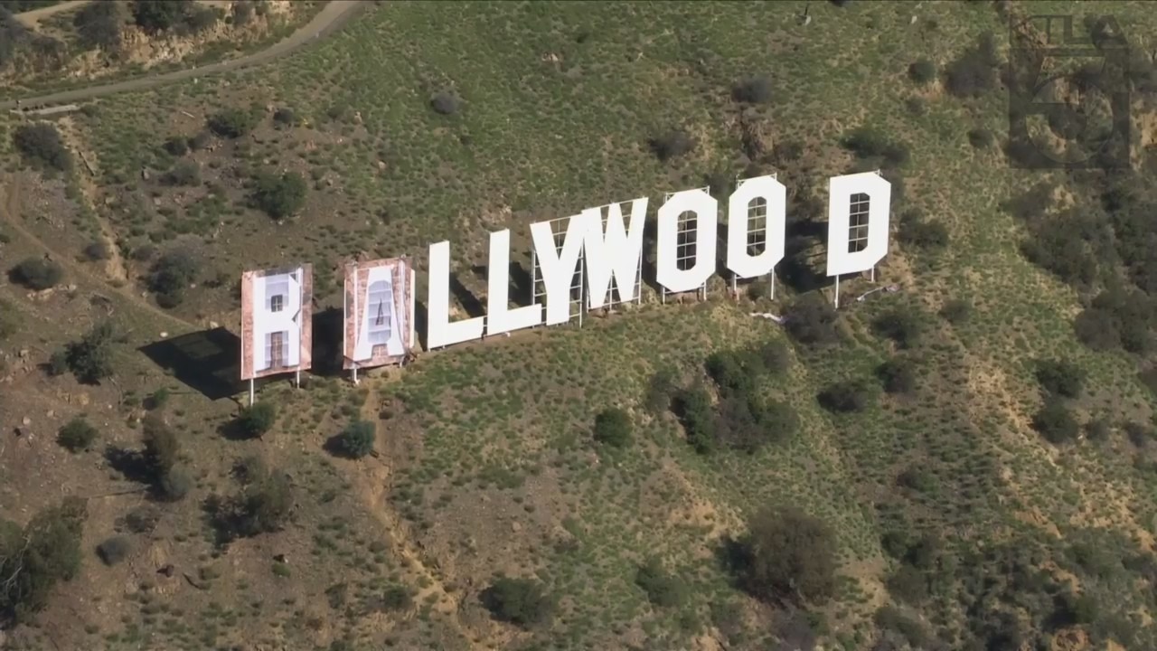 Crews were working to transform the Hollywood sign to say "Rams House" on Feb. 14, 2022, following the L.A. team's Super Bowl victory. (KTLA)