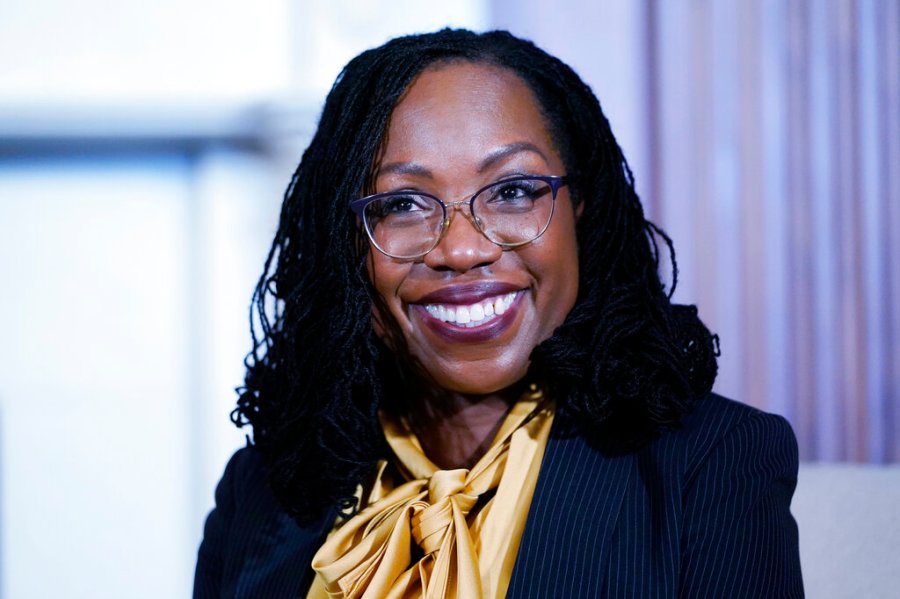 Supreme Court nominee Ketanji Brown Jackson smiles as she sits down for a meeting with Senate Majority Leader Chuck Schumer of N.Y., on Capitol Hill in Washington, Wednesday, March 2, 2022. (AP Photo/Susan Walsh)