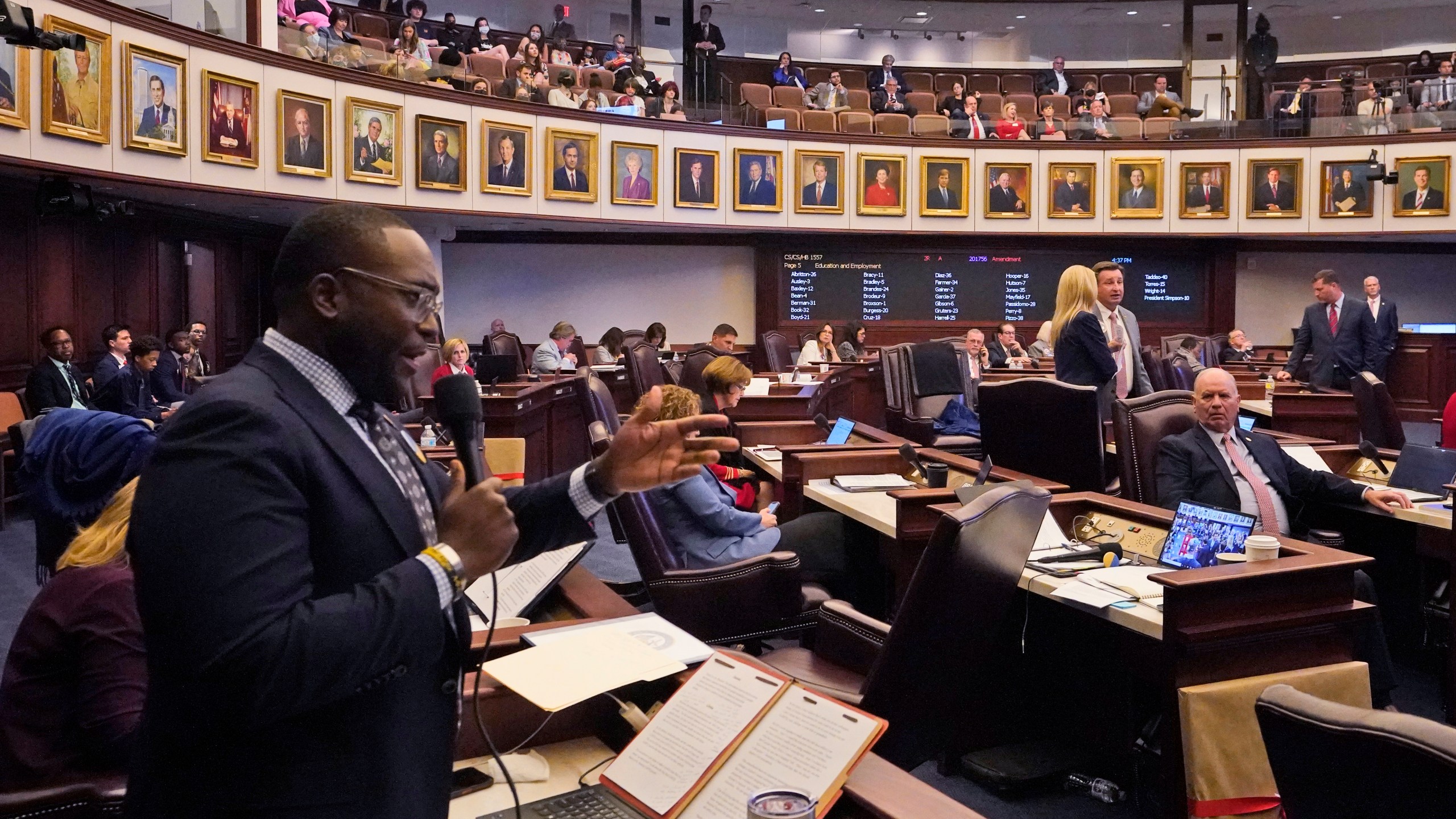 Florida Sen. Shevrin Jones, left, speaks about his proposed amendment to a bill, dubbed by opponents as the "Don't Say Gay" bill, to forbid discussions of sexual orientation and gender identity in schools, during a legislative session at the Florida State Capitol, Monday, March 7, 2022, in Tallahassee, Fla. (AP Photo/Wilfredo Lee)