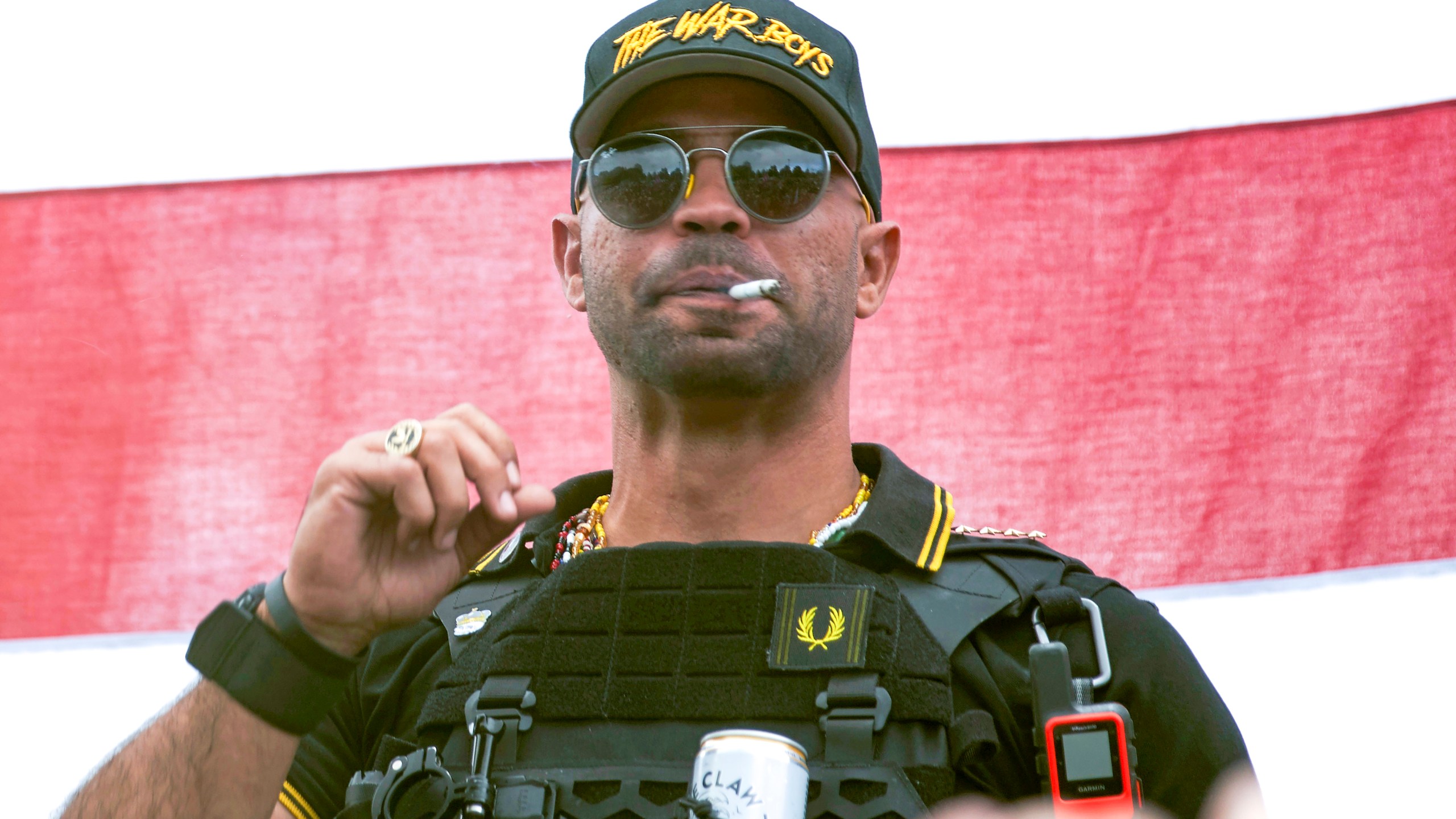 In this Sept. 26, 2020, file photo, Proud Boys leader Henry "Enrique" Tarrio wears a hat that says The War Boys during a rally in Portland, Ore. (Allison Dinner/Associated Press)