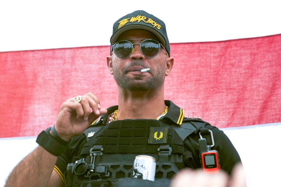 In this Sept. 26, 2020, file photo, Proud Boys leader Henry "Enrique" Tarrio wears a hat that says The War Boys during a rally in Portland, Ore. (Allison Dinner/Associated Press)