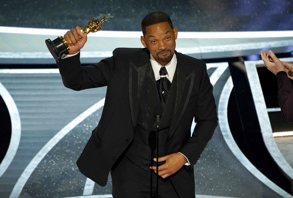 Will Smith accepts the award for best performance by an actor in a leading role for "King Richard" at the Oscars on Sunday, March 27, 2022, at the Dolby Theatre in Los Angeles. (AP Photo/Chris Pizzello)