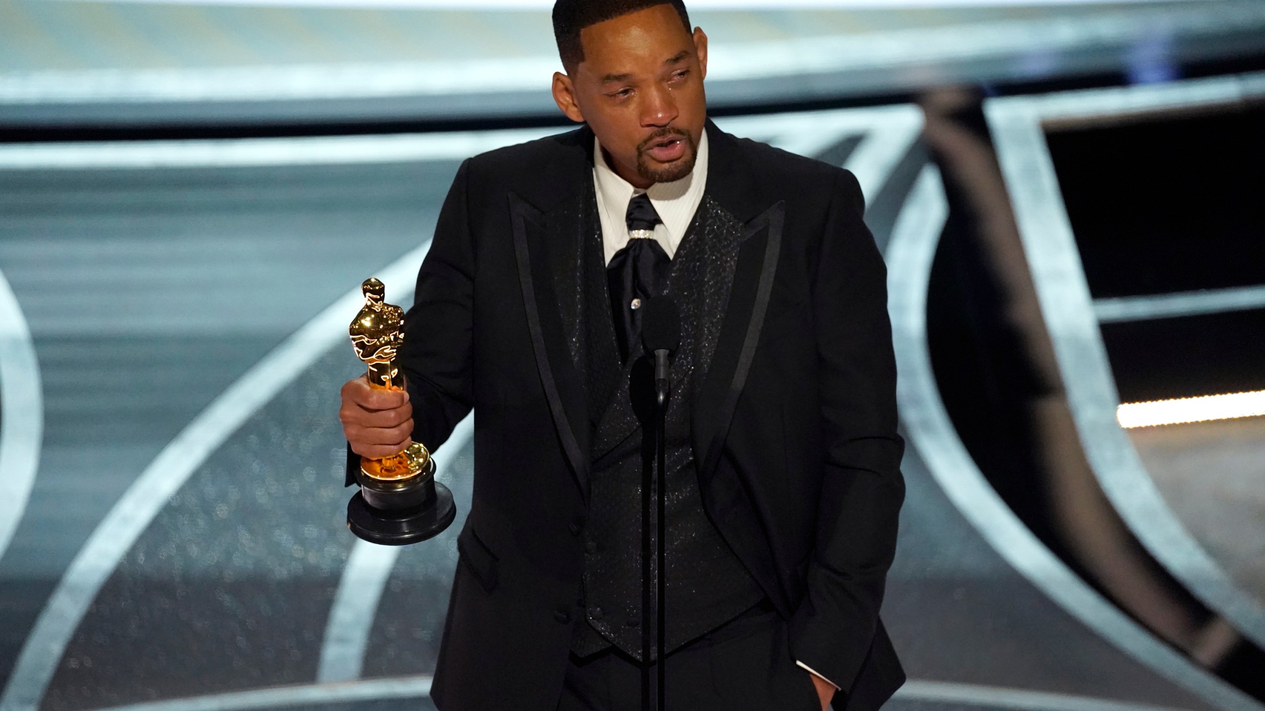 Will Smith cries as he accepts the award for best performance by an actor in a leading role for "King Richard" at the Oscars on March 27, 2022, at the Dolby Theatre in Los Angeles. (Chris Pizzello/Associated Press)