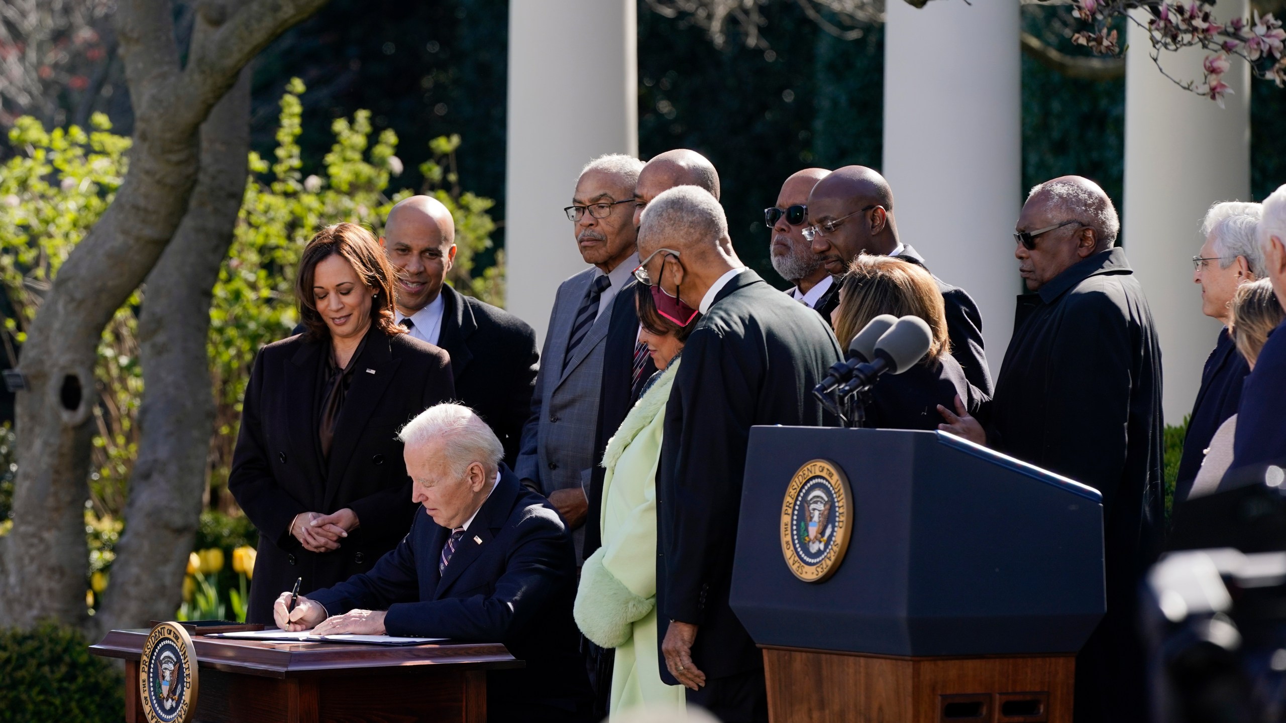 President Joe Biden signs the Emmett Till Anti-Lynching Act in the Rose Garden of the White House on March 29, 2022. (Patrick Semansky/Associated Press)