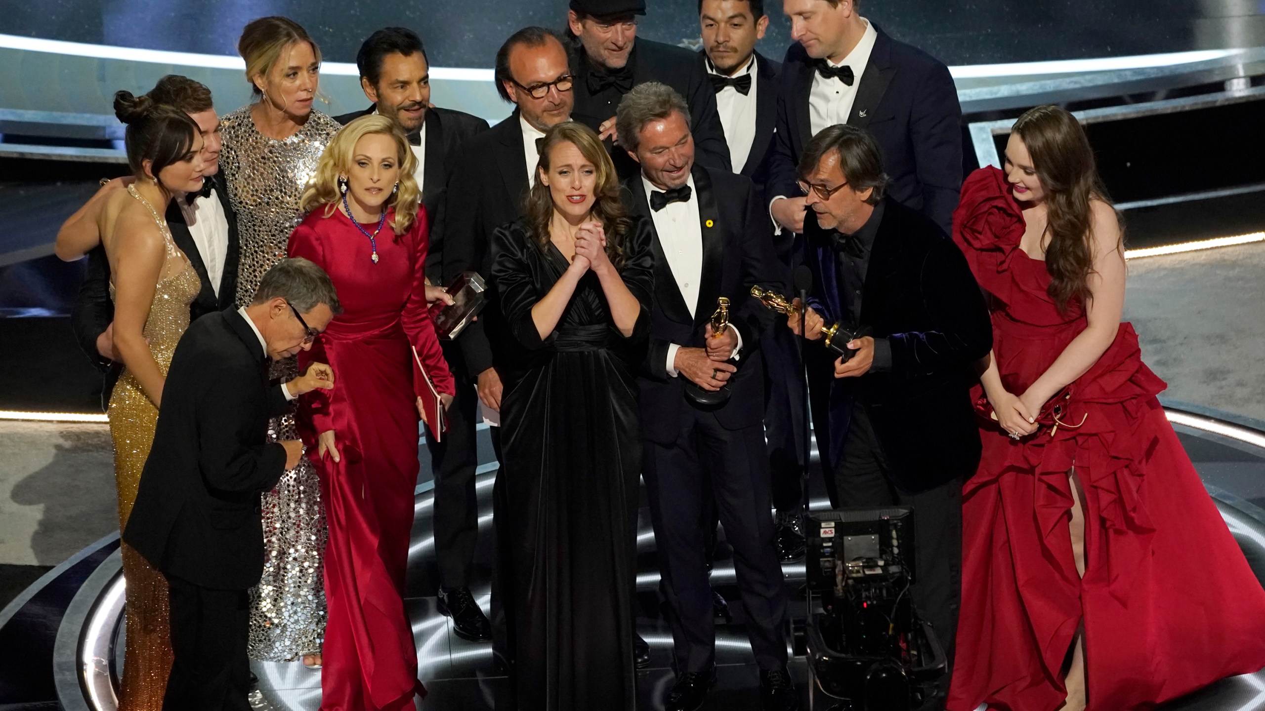 The cast and crew of "CODA" accept the award for best picture at the Oscars on Sunday, March 27, 2022, at the Dolby Theatre in Los Angeles. (AP Photo/Chris Pizzello)