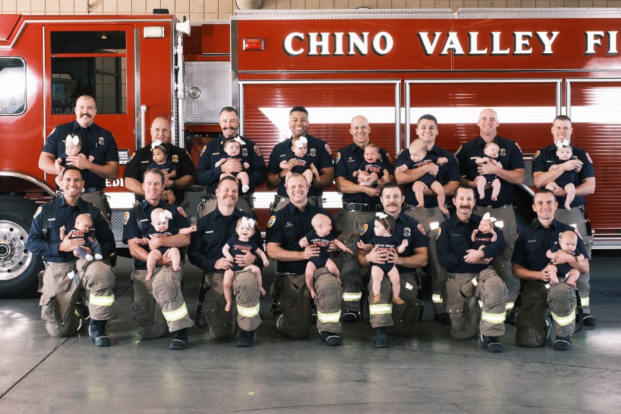 Firefighters at the Chino Valley Fire District posed with their babies in a photo shared by the agency on March 3, 2022.